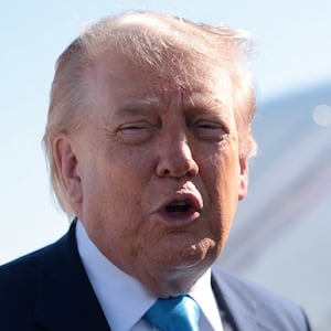 U.S. President Donald Trump speaks to the media as he departs Joint Base Andrews for the United States Coast Guard Academy in Connecticut, in Maryland, U.S., May 20, 2026. REUTERS/Evelyn Hockstein