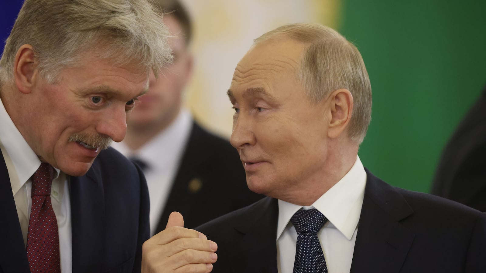 Russian President Vladimir Putin talks to Presidential Press Secretary Dmitry Peskov during the Summit of the Commonwealth of Independent States (CIS), October 8, 2024, in Moscow, Russia.