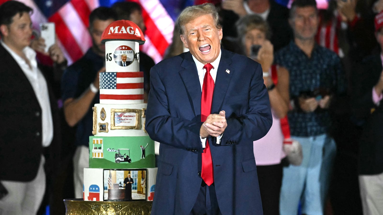 Donald Trump gestures by his birthday cake, created by Club 47, during a campaign rally as he celebrates his 78th birthday at West Palm Convention Center, in West Palm Beach, Florida, on June 14, 2024.