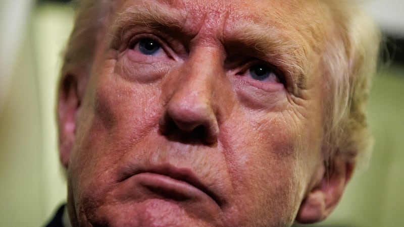 IN FLIGHT - FEBRUARY 06: U.S. President Donald Trump gaggles with reporters while aboard Air Force One on February 6, 2026 en route to Palm Beach, Florida. The President is spending the weekend at Mar-a-Lago, his private club. (Photo by Samuel Corum/Getty Images)