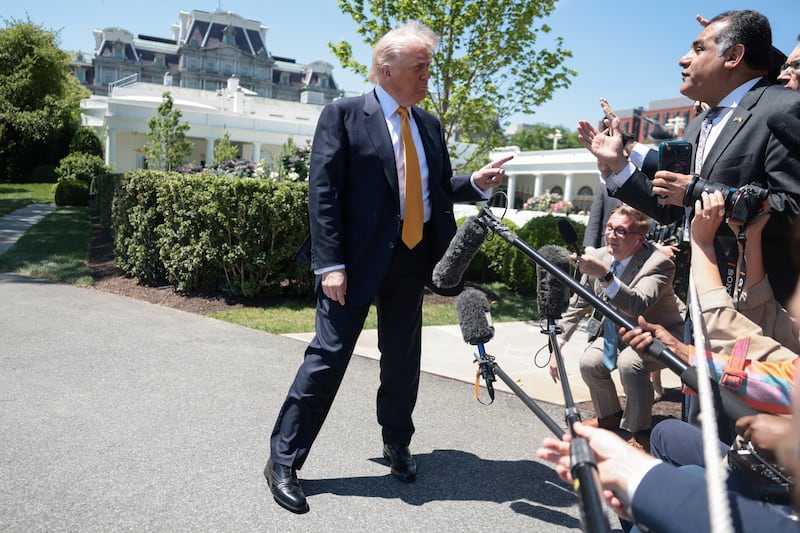 President Donald Trump speaks to the press, ahead of departing the White House for Joint Base Andrews en route to Beijing, China, in Washington, D.C., U.S., May 12, 2026.