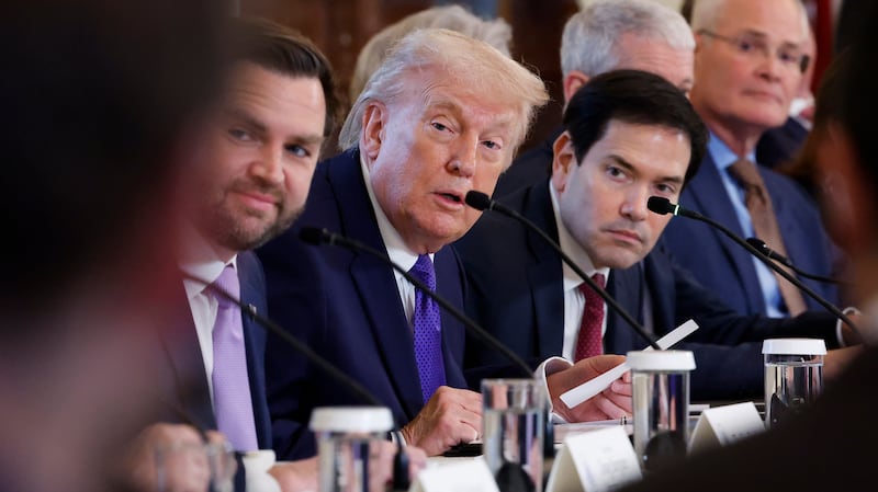 WASHINGTON, DC - JANUARY 09: U.S. President Donald Trump (C) looks on during a meeting with oil and gas executives in the East Room of the White House on January 9, 2026 in Washington, DC. Trump is holding the meeting to discuss plans for investment in Venezuela after ousting leader its leader Nicolás Maduro. (Photo by Chip Somodevilla/Getty Images)