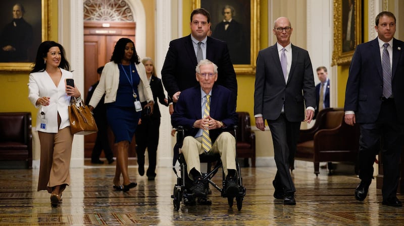 U.S. Senator Mitch McConnell (R-KY) sits in a wheelchair, as he is pushed on his way to speak to reporters outside the Senate Chamber after he returned to Capitol Hill in Washington, D.C., U.S., September 14, 2026.