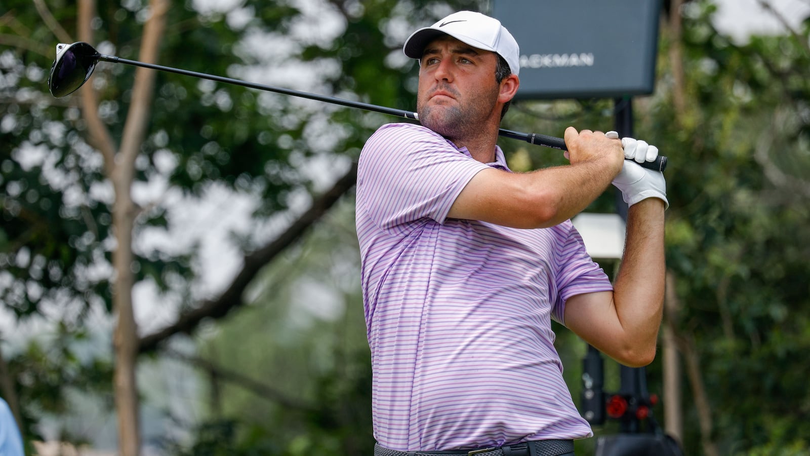 Scottie Scheffler hits his tee shot on the ninth hole during the third round of the Charles Schwab Challenge golf tournament on May 25, 2024 in Forth Worth, Texas.
