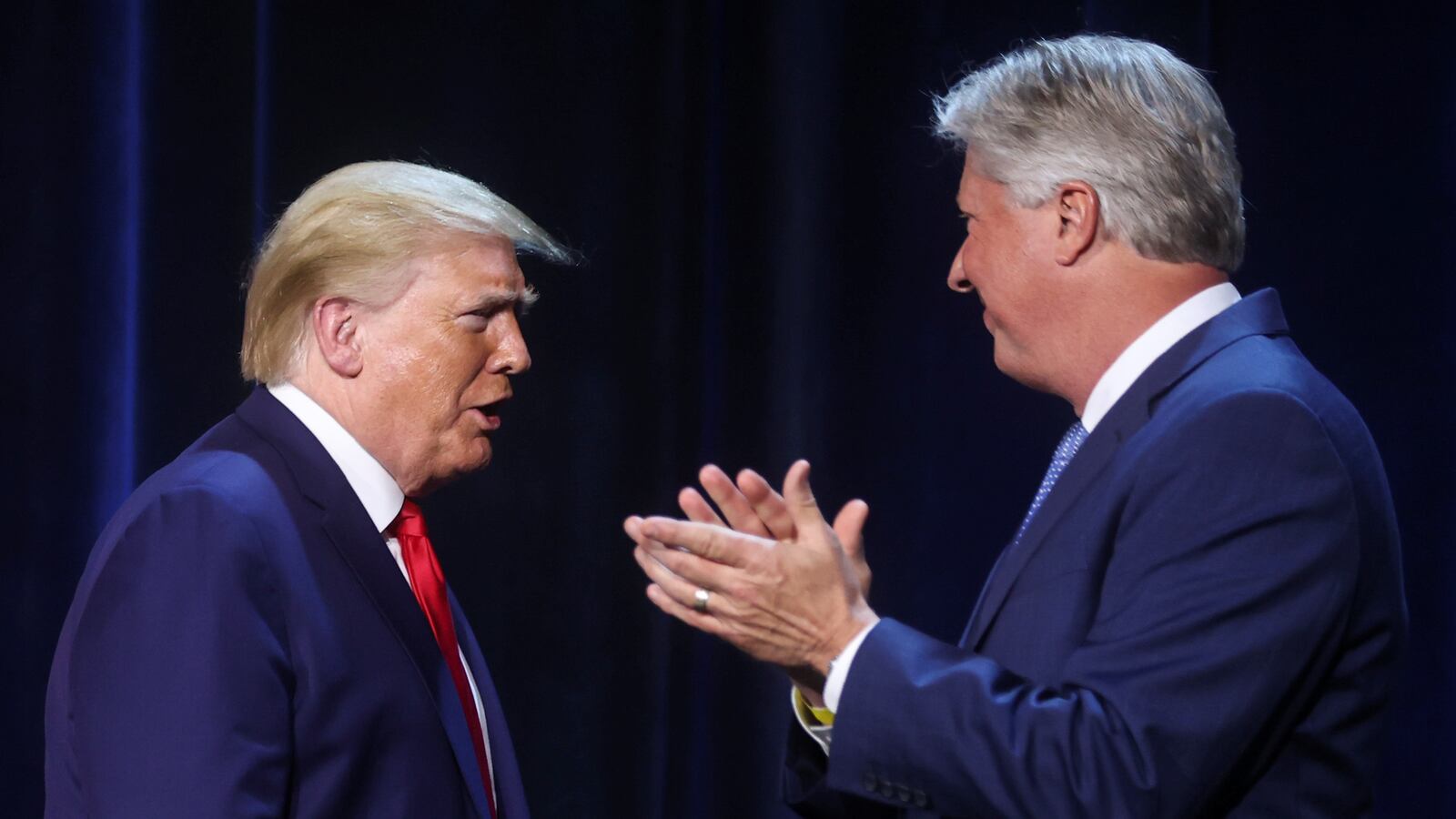 U.S. President Donald Trump is greeted by Pastor Robert Morris in 2020.