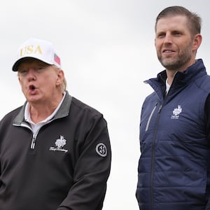 U.S. President Donald Trump speaks next to Donald Trump Jr. (L) and Eric Trump as they attend the ribbon-cutting ceremony at a new 18-hole course at Trump International Golf Links on July 29, 2025 in Balmedie, near Aberdeen, Scotland. President Trump is visiting Scotland in a trip that’s part-vacation, part-work, as he stayed at his Trump Turnberry golf course, followed by Trump International Golf Links in Aberdeenshire, between July 25 to 29.