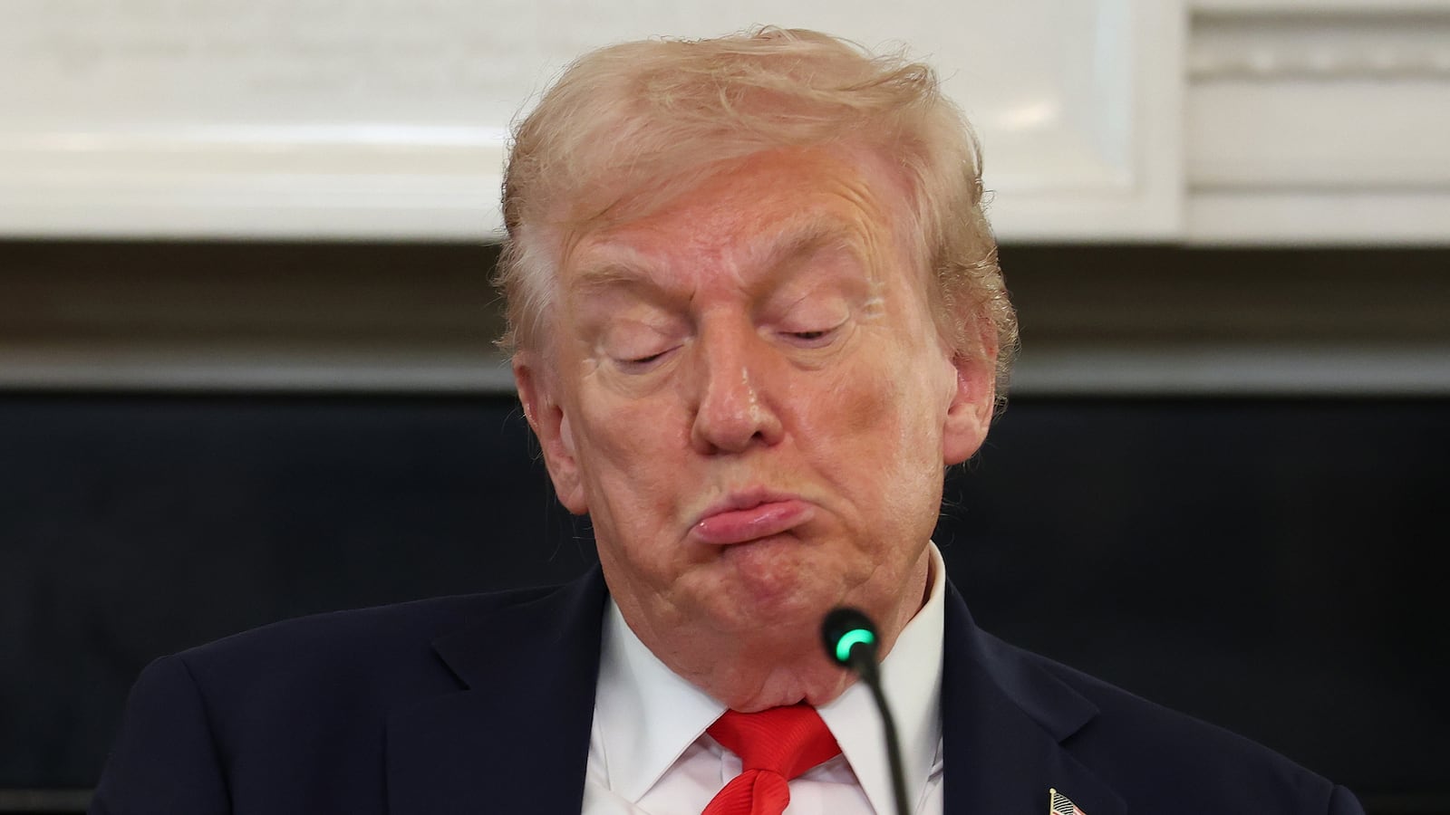 WASHINGTON, DC - OCTOBER 08: (EDITOR'S NOTE: Alternate crop) U.S. President Donald Trump reads a note handed to him by U.S. Secretary of State Marco Rubio he said was regarding Middle East peace talks during a roundtable discussion in the State Dining Room of the White House on October 08, 2025 in Washington, DC. Trump’s administration held the roundtable to discuss the anti-fascist Antifa movement after signing an executive order designating it as a “domestic terrorist organization”. (Photo by Anna Moneymaker/Getty Images)