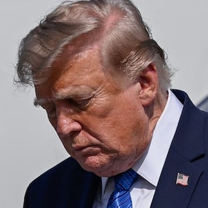 U.S. President Donald Trump disembarks Air Force One at Morristown Municipal Airport in Morristown, New Jersey, U.S., July 31, 2026. REUTERS/Daniel Heuer