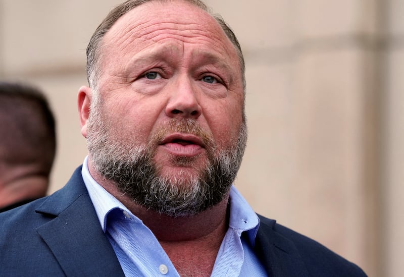 Alex Jones speaks to reporters at the court house as he faces a second defamation trial over Sandy Hook claims in Waterbury, Connecticut, U.S., September 22, 2022.   REUTERS/Michelle McLoughlin