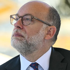Director of the Office of Management and Budget (OMB) Russell Vought listens as President Donald Trump speaks at a "Rose Garden Club" lunch in the Rose Garden of the White House in Washington, DC, on October 21, 2025.