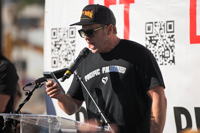 Spencer Pratt speaks during the "They Let Us Burn!" rally on the first anniversary of the deadly Palisades Fire, in the Pacific Palisades neighborhood of Los Angeles, California, on January 7, 2026.