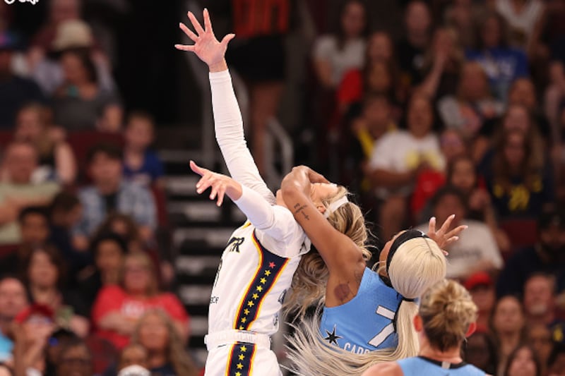 Sophie Cunningham #8 of the Indiana Fever is fouled by DiJonai Carrington #7 of the Chicago Sky during the first half at United Center on August 08, 2026 in Chicago, Illinois