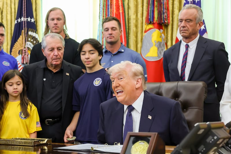 WASHINGTON, DC - MAY 05: U.S. President Donald Trump is joined by (L-R) retired professional golfer Gary Player, MLB pitcher Noah Syndergaard, professional golfer Bryson DeChambeau and U.S. Secretary of Health and Human Services Robert F. Kennedy Jr. as he speaks during a proclamation signing in the Oval Office of the White House on May 05, 2026 in Washington, DC. President Trump signed a presidential memorandum restoring the Presidential Fitness Test Award, which was reinstated by executive order in July 2025 and reintroduces a performance-based benchmark in physical education. (Photo by Anna Moneymaker/Getty Images)