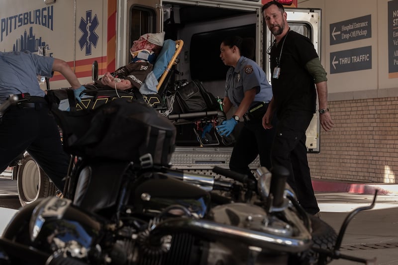Robby checks on the damage to his motorcycle.