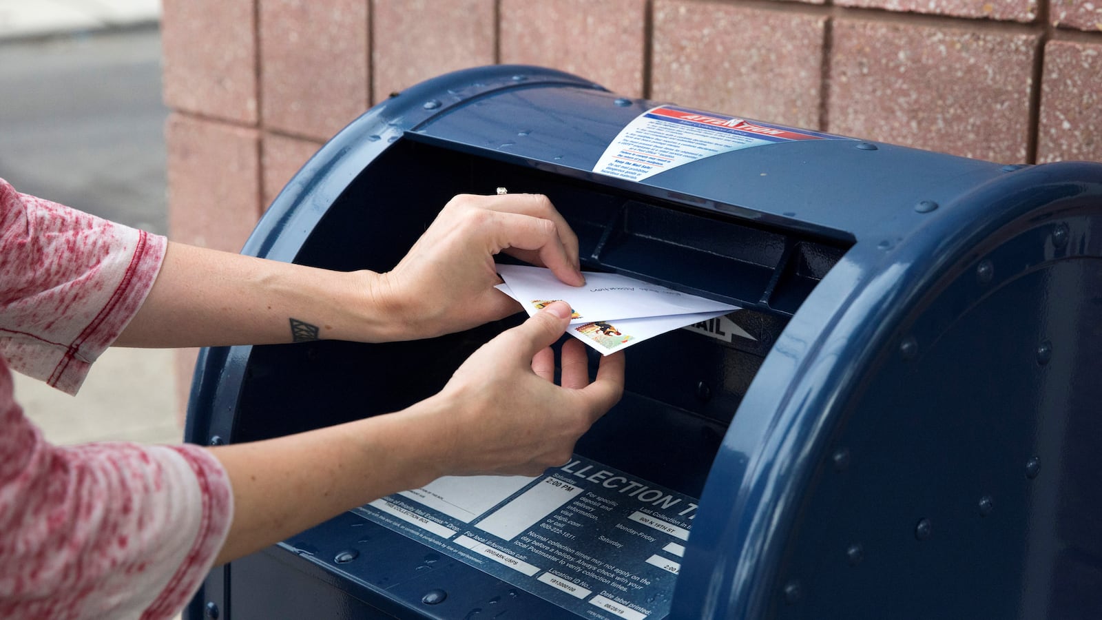 An individual mails letters through the U.S. Postal Service