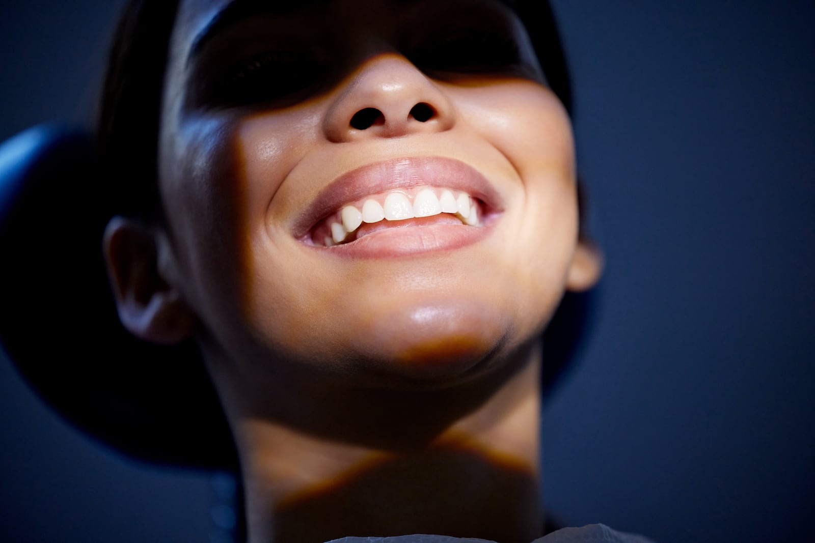 a woman patient at the dentist smiling