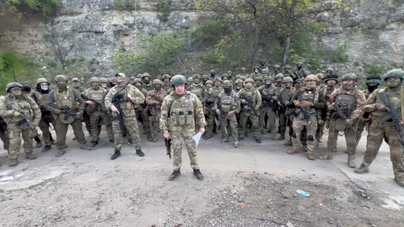 Founder of Wagner private mercenary group Yevgeny Prigozhin makes a statement as he stand next to Wagner fighters in an undisclosed location in the course of Russia-Ukraine conflict, in this still image taken from video released May 5, 2023.