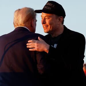 Elon Musk embraces Donald Trump.
