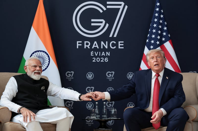 U.S. President Donald Trump holds hands with Indian Prime Minister Narendra Modi during the G7 Summit in Evian-les-Bains, France, June 17, 2026. REUTERS/Evelyn Hockstein