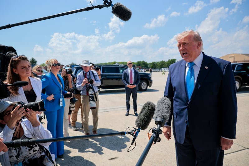 President Donald Trump speaks to reporters after arriving on Air Force One on May 20, 2026 back at Joint Base Andrews, Maryland.