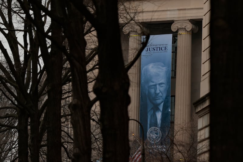 A banner of President Donald Trump is hung on the Department of Justice on February 19, 2026 in Washington, DC. The banner reads "Make America Safe Again."