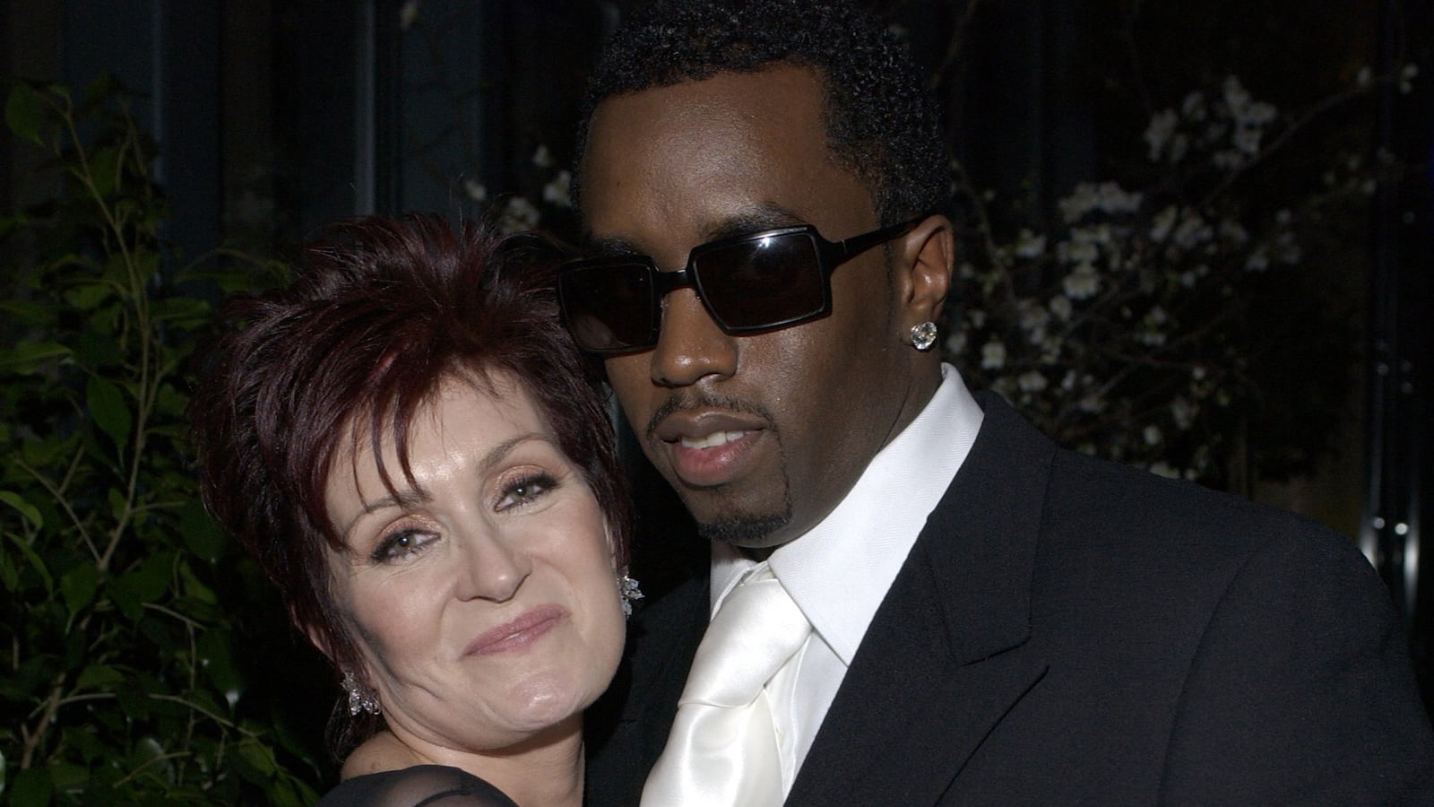 Sharon Osbourne and Diddy at a Grammy party.