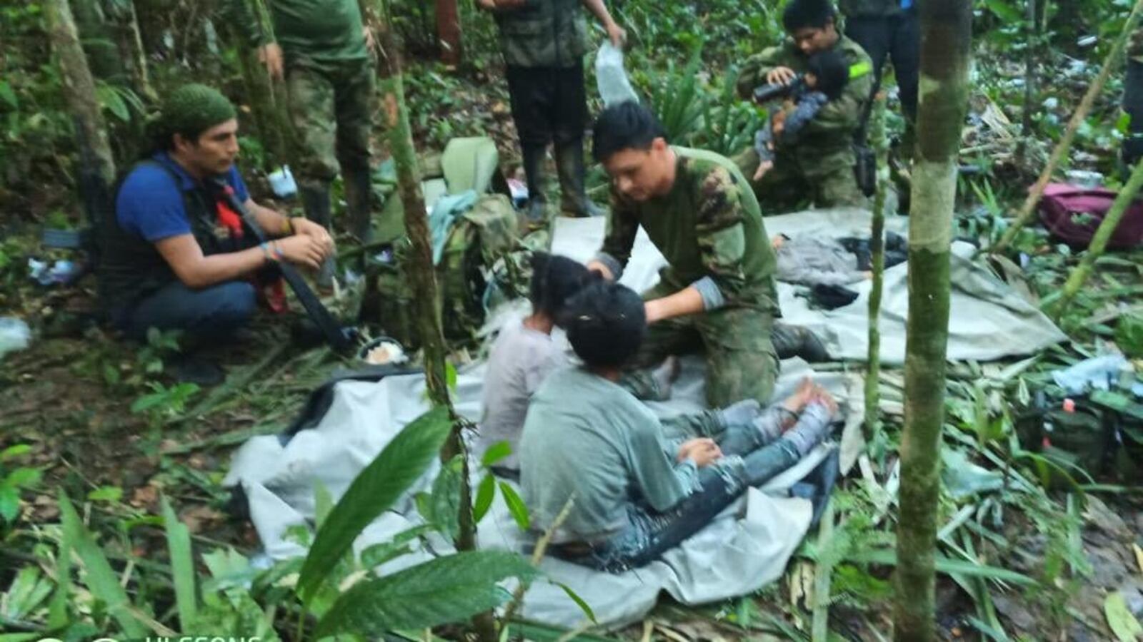 Rescuers shown with the missing children