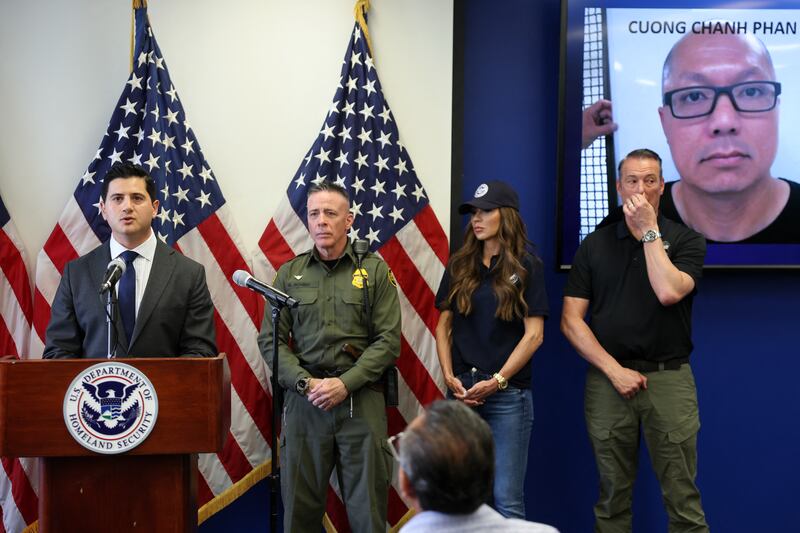 US Attorney for the Central District of California Bilal Essayli (L) speaks during a news conference alongside (L/R) Gregory Bovino, Chief Patrol Agent at the El Centro Sector of US Customs and Border Patrol, Department of Homeland Security Secretary Kristi Noem and Acting ICE Director Todd Lyons,