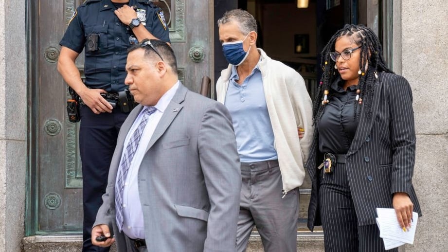 Jonathan Kaye is pictured in police custody leaving the NYPD 78th Precinct stationhouse in Brooklyn