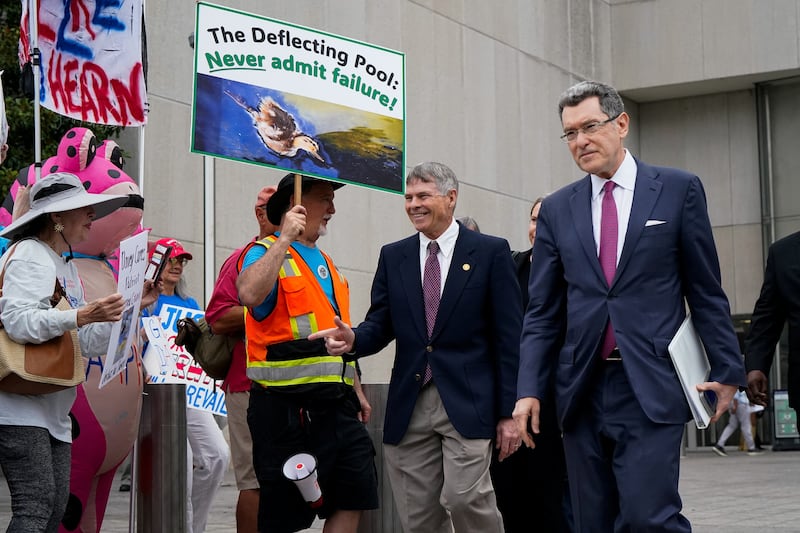 Former U.S. Olympic canoeist David Hearn gestures while walking with his attorney Norm Eisen following Hearn’s arraignment on a felony destruction of property charge related to “vandalizing” the Lincoln Memorial Reflecting Pool, at DC Superior Court in Washington, D.C., U.S., July 9, 2026. REUTERS/Elizabeth Frantz