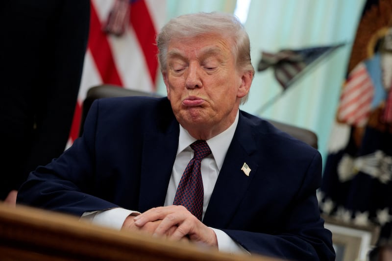 U.S. President Donald Trump reacts