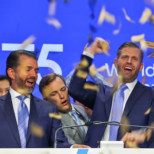Eric and Donald Trump Jr. celebrate the opening of public trading on their WLFI coin in August, 2025.