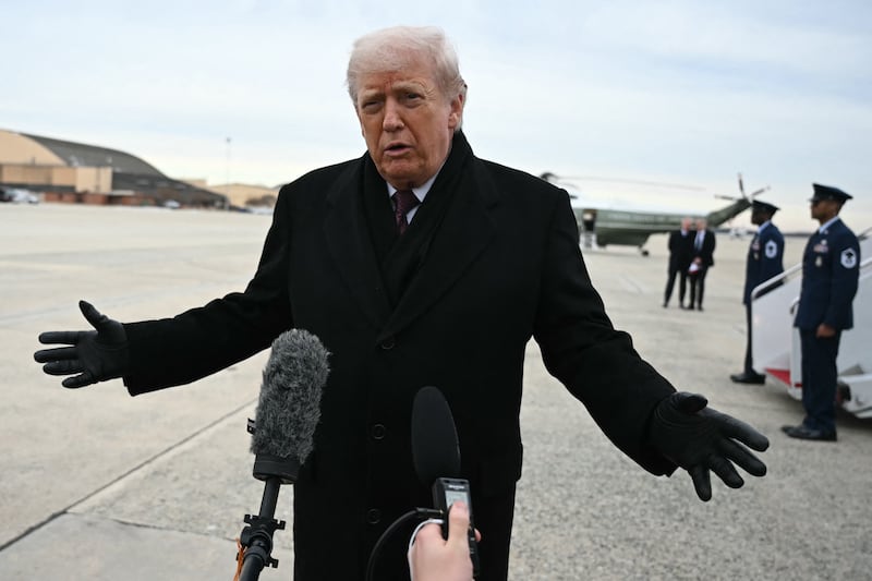 President Donald Trump speaks to reporters after stepping off Air Force One at Joint Base Andrews on December 17, 2025.