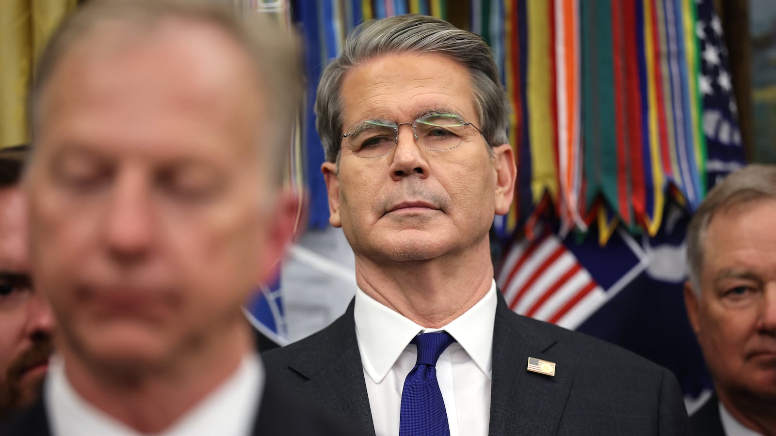 WASHINGTON, DC - NOVEMBER 12: U.S. Treasury Secretary Scott Bessent listens as President Donald Trump delivers remarks before signing recently passed funding legislation to reopen the federal government in the Oval Office of the White House on November 12, 2025, in Washington, DC. The legislation, passed by the House of Representatives tonight, funds the federal government until the end of January 2026 and ends the 43-day government shutdown, the longest in the nation’s history. (Photo by Win McNamee/Getty Images)