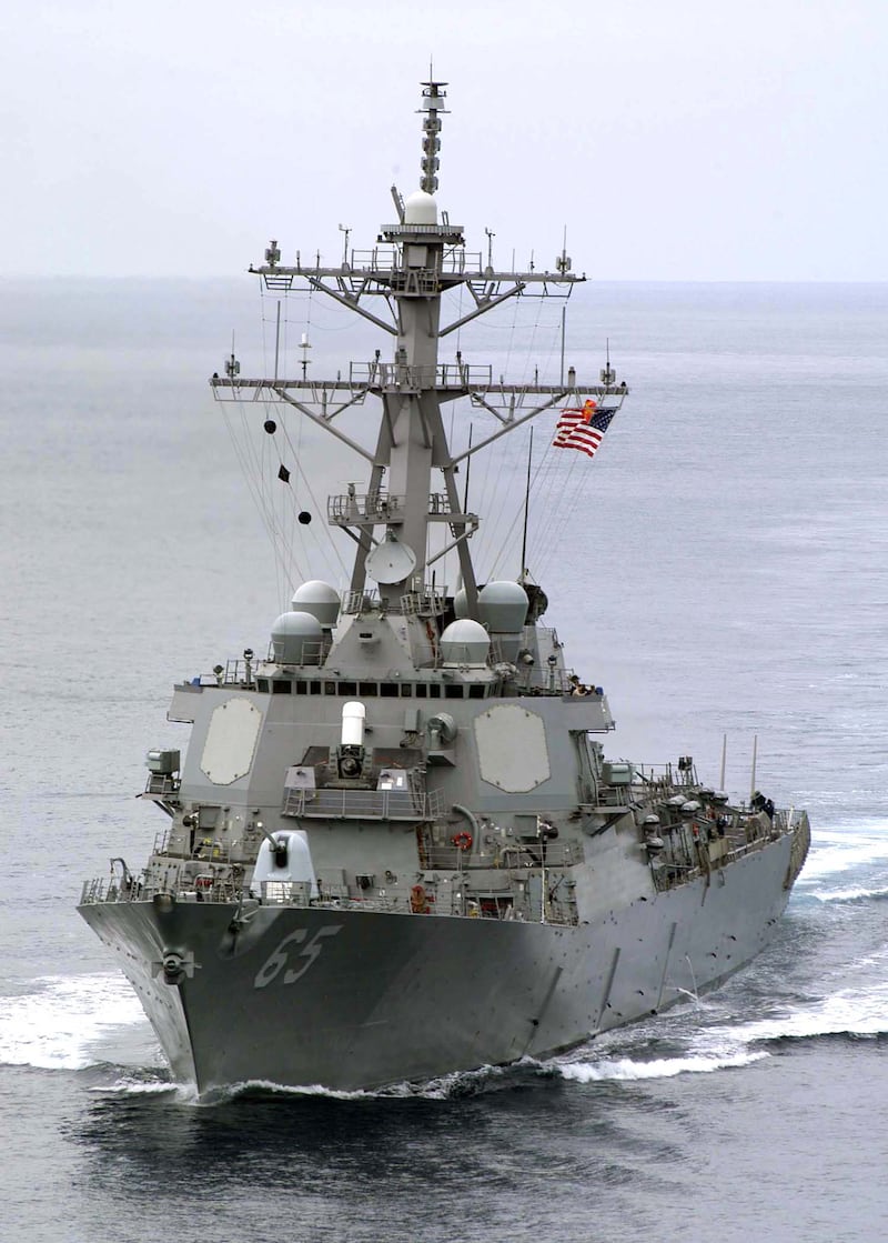 AT SEA - AUGUST 28:  In this handout image provided by the U.S. Navy, guided missile destroyer USS Benfold (DDG 65) cuts through the water during her approach on the aircraft carrier USS Abraham Lincoln (CVN 72) during an underway replenishment (UNREP) August 28, 2004. The USS Benfold has been ordered to the Bay of Bengal, to aid in humanitarian assistance and disaster relief after a Tsunami hit coastal regions throughout Southeast Asia. Over 80,000 Tsunami related deaths have been reported since the December 26 natural disaster.  (Photo by Michael S. Kelly/U.S. Navy via Getty Images)