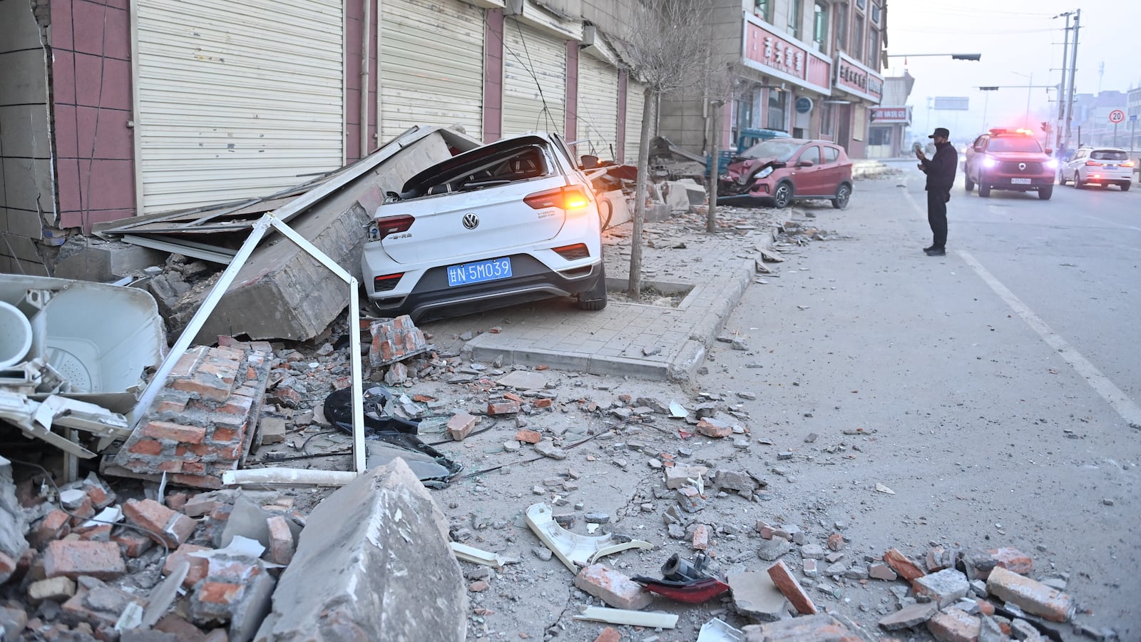 Cars are damaged in China after a deadly earthquake struck overnight.