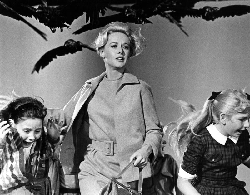 1963 Tippi Hedren and children attacked by crows in a scene from the Alfred Hitchcock thriller 'The Birds'. (Photo by Screen Archives/Getty Images)