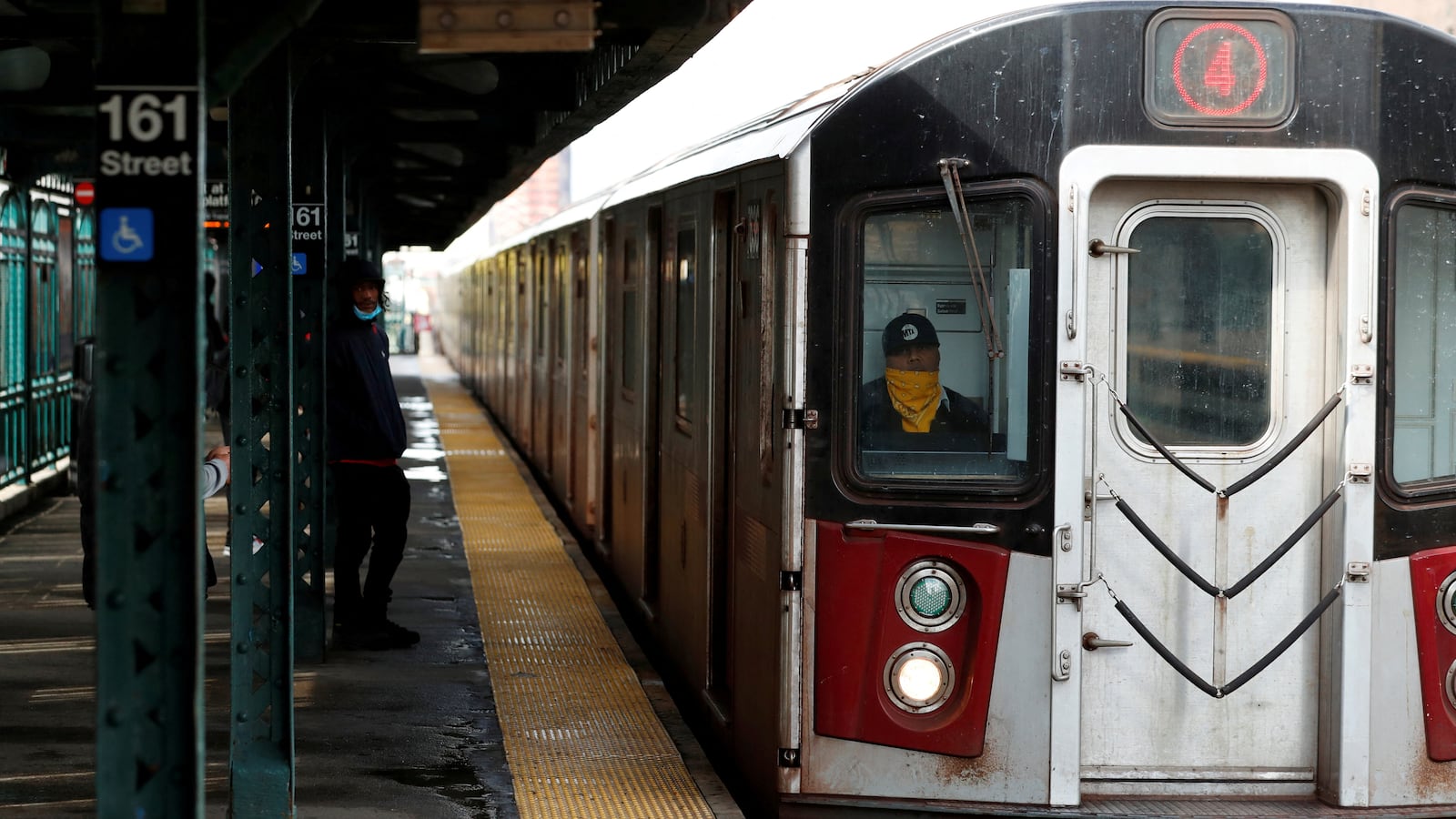 An underground subway stops at a station in the Bronx.