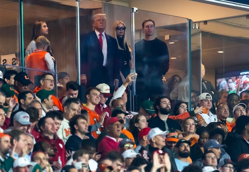 Jan 19, 2026; Miami Gardens, FL, USA; United States President Donald Trump (left) with daughter Ivanka Trump (center) and husband Jared Kushner during the College Football Playoff National Championship game at Hard Rock Stadium. Mandatory Credit: Mark J. Rebilas-Imagn Images