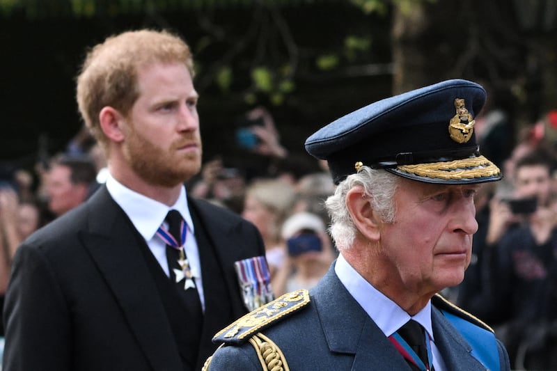 King Charles III and Prince Harry walk behind the coffin of Queen Elizabeth II during a procession from Buckingham Palace to the Palace of Westminster in London on September 14, 2022.