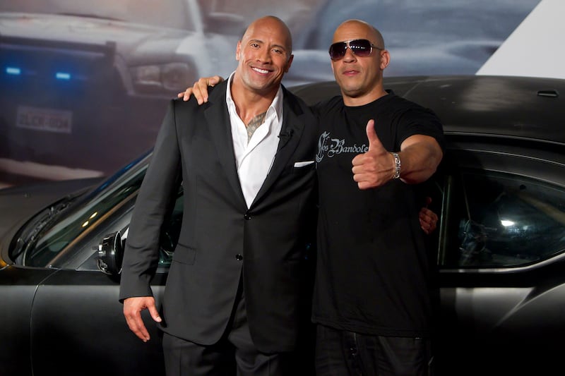 RIO DE JANEIRO, BRAZIL - APRIL 15:   Dwayne Johnson (The Rock) and Vin Diesel (R) pose for photographers during the premiere of the movie "Fast and Furious 5" at Cinepolis Lagoon on April 15, 2011 in Rio de Janeiro, Brazil. (Photo by Buda Mendes/LatinContent via Getty Images)