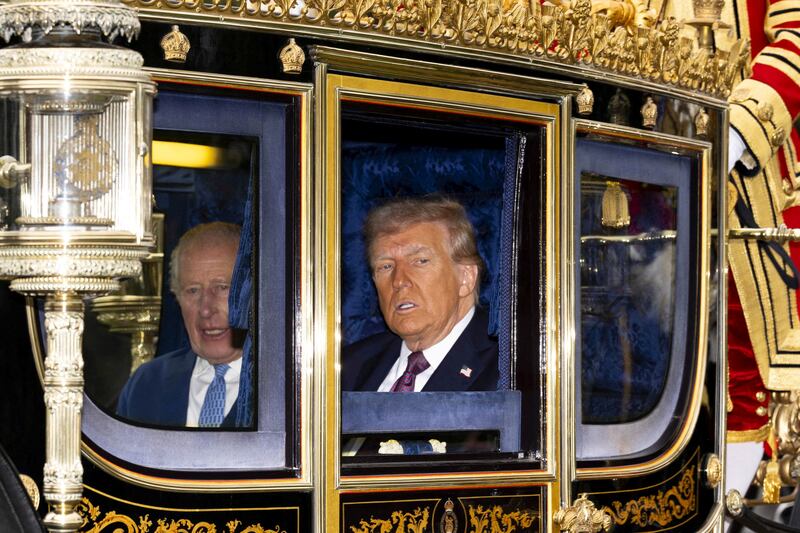 FILE PHOTO: King Charles III and US President Donald Trump sit during the carriage procession to Windsor Castle, Berkshire, ahead of the ceremonial welcome on day one of the US President's second state visit to the UK. Picture date: Wednesday September 17, 2025.  Jordan Pettitt/Pool via REUTERS/File Photo