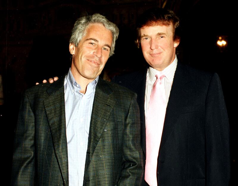 Jeffrey Epstein (left) and Donald Trump pose together at the Mar-a-Lago estate, Palm Beach, Florida, 1997.
