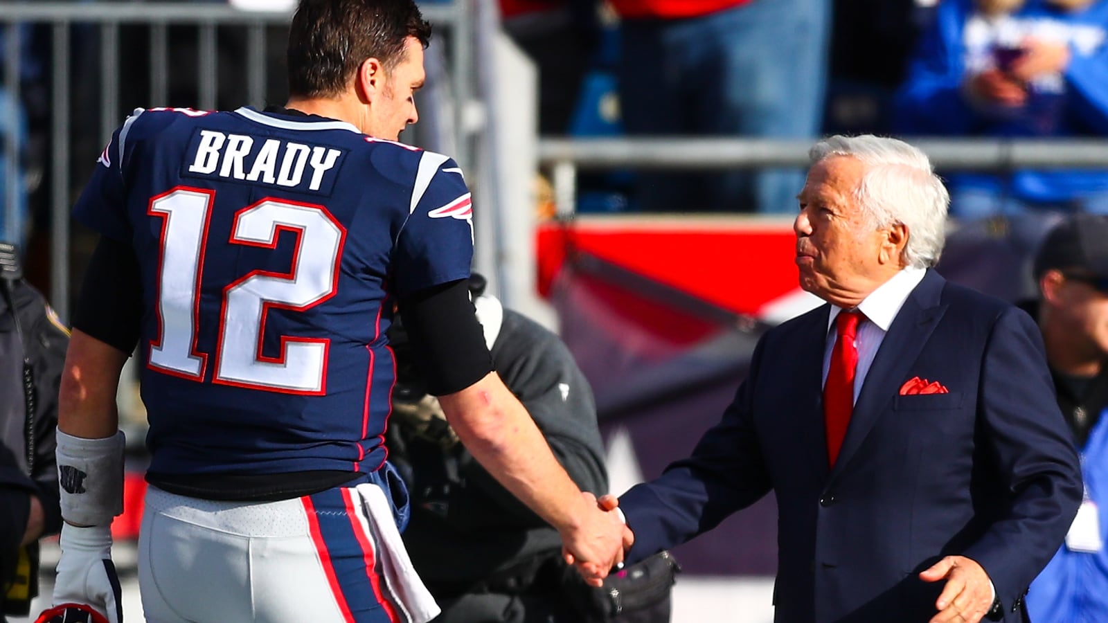 Tom Brady #12 shakes the hand of owner Robert Kraft of the New England Patriots before a game against the Miami Dolphins at Gillette Stadium on December 29, 2019 in Foxborough, Massachusetts.
