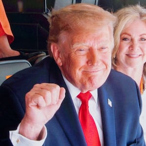 US President Donald Trump on a screen as he attends an NCAA college football game between the University of Texas and the University of Tennessee at Neyland Stadium in Knoxville, Tennessee, US, September 26, 2026. REUTERS/Jonathan Ernst