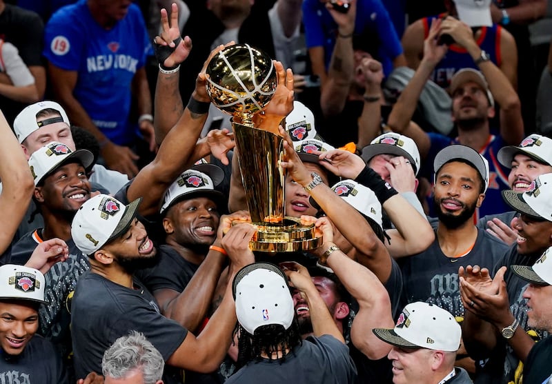 The New York Knicks hoist the trophy after defeating the San Antonio Spurs in game five of the 2026 NBA Finals to win the 2026 NBA Championship at Frost Bank Center.