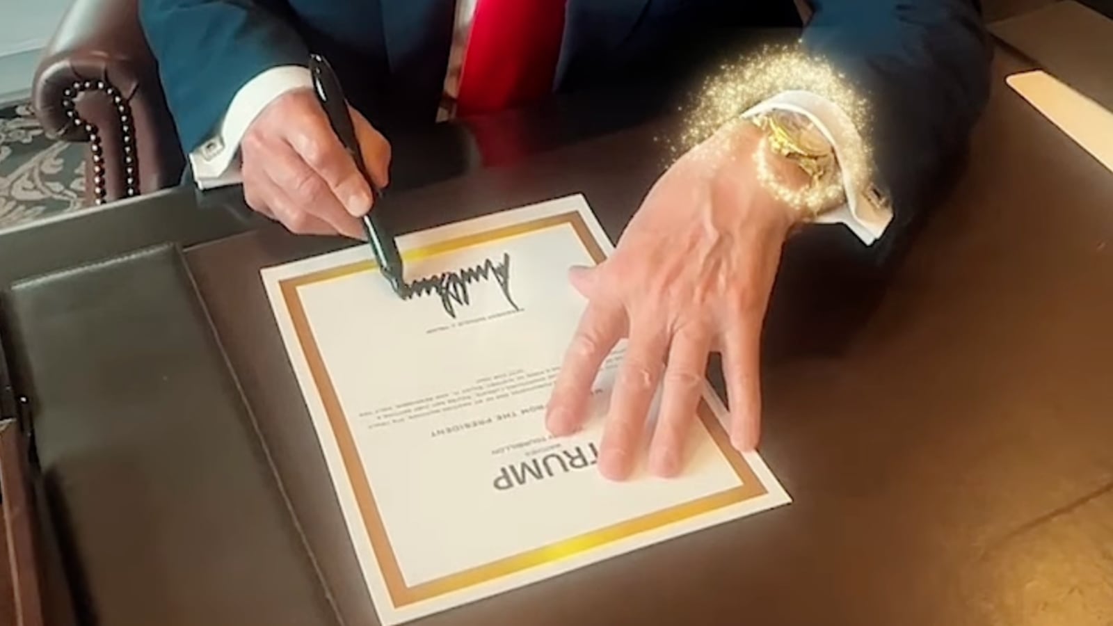 Donald Trump signs a certificate for a one of his Trump Watch endorsed products.