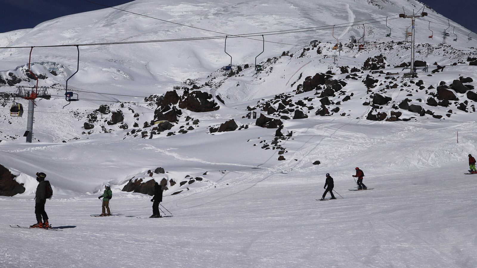 KABARDINO-BALKARIA, RUSSIA - FEBRUARY 12: People ski during their winter vacation at Mount Elbrus, highest peak of the Caucasus Mountains in Kabardino-Balkaria of Russia on February 12, 2023. Mount Elbrus is known as the highest peak in Russia and Europe. (Photo by Denis Abramov/Anadolu Agency via Getty Images)