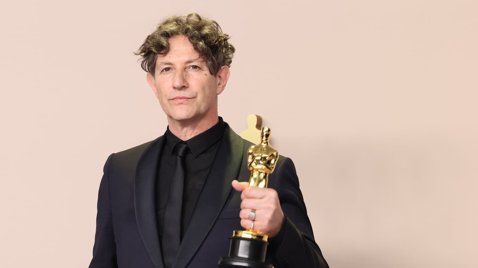 Jonathan Glazer (R), winner of the Best International Feature Film award for “The Zone of Interest”, poses in the press room during the 96th Annual Academy Awards at Ovation Hollywood on March 10, 2024 in Hollywood, California.