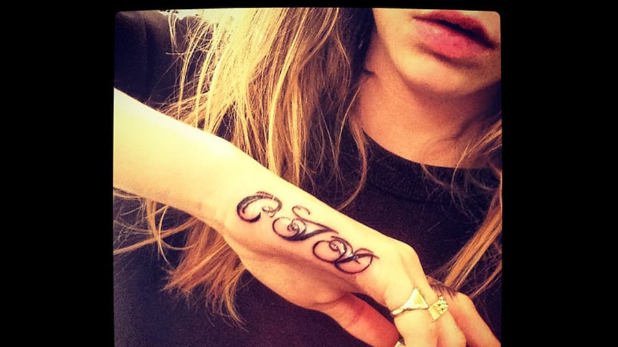 articles/2013/05/22/cara-delevingne-gets-another-tattoo-fashion-influencers-top-forbes-most-powerful-women/130522-cara-delevingne-cheat_glvqxl